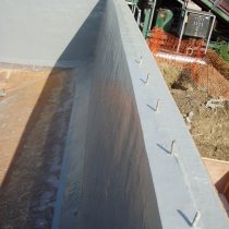 Odbudowany beton i zbiornik zabezpieczony przed przyszłymi uszkodzeniami z użyciem materiału Belzona 5811 (Immersion Grade) Odbudowany beton i zbiornik zabezpieczony przed przyszłymi uszkodzeniami z użyciem materiału Belzona 5811 (Immersion Grade)